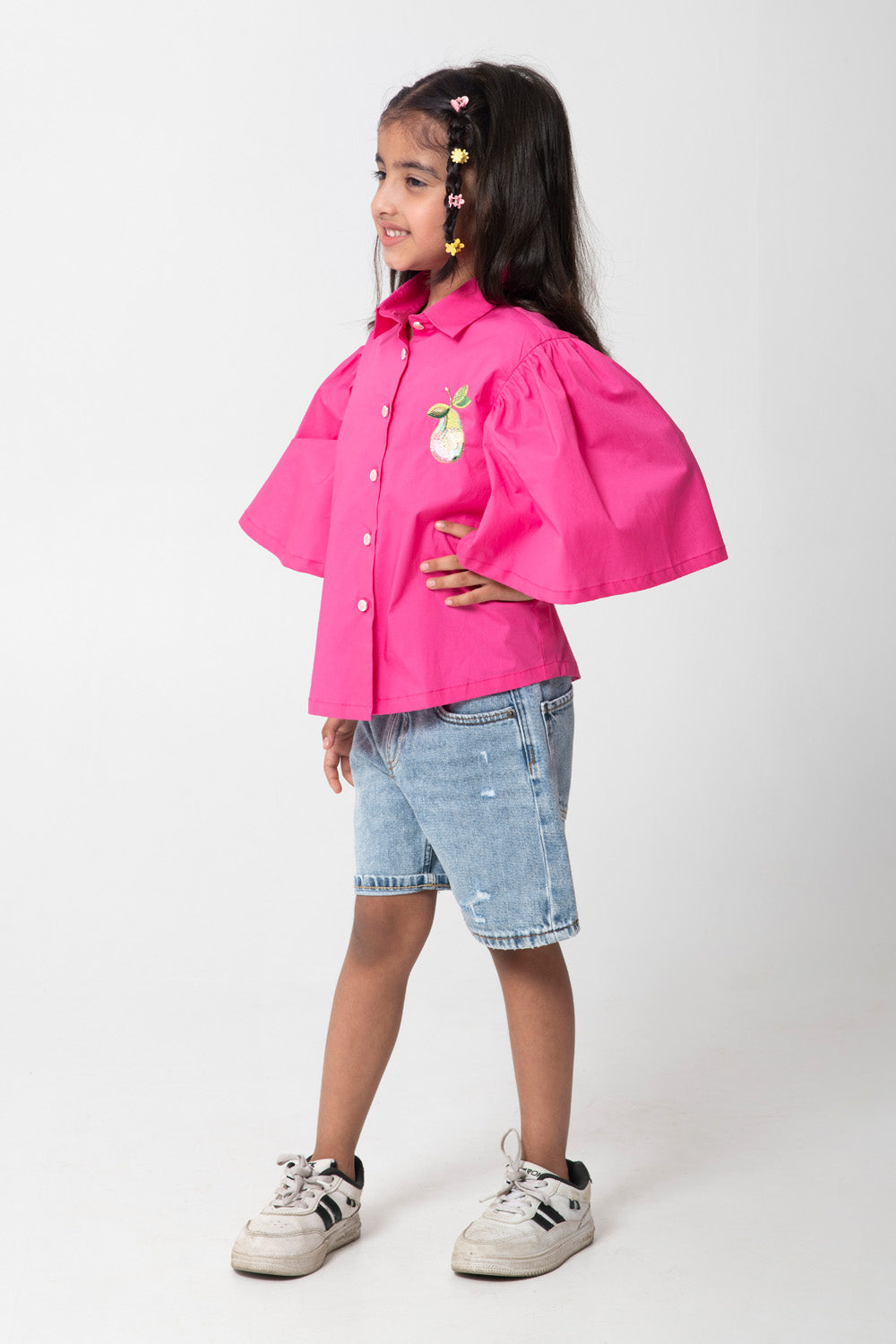 Pink shirt with pear embroidered.