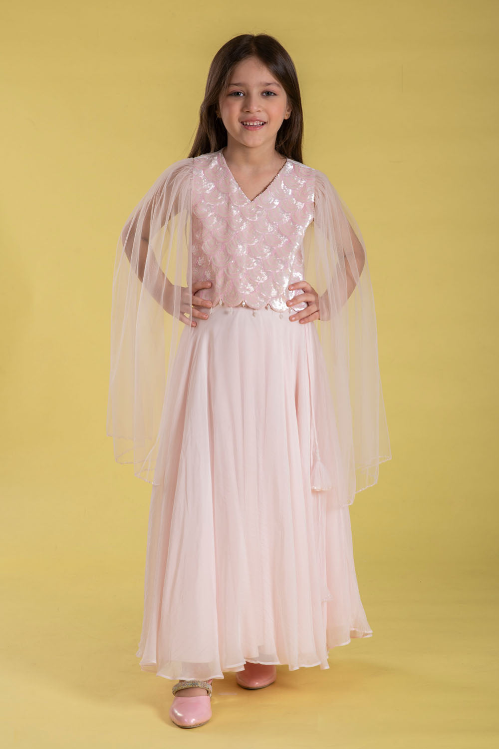 A FAIRYTALE BLUSH PINK LEHENGA SET FEATURING A BEAUTIFULLY EMBELLISHED PEARL SEQUIN BLOUSE WITH SHEER FULL FAIRY SLEEVES