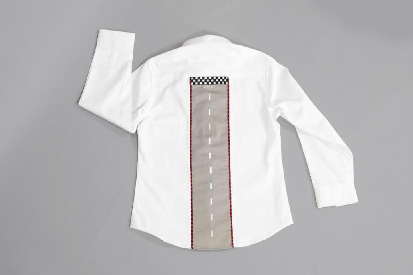 Motif on front racing track on back