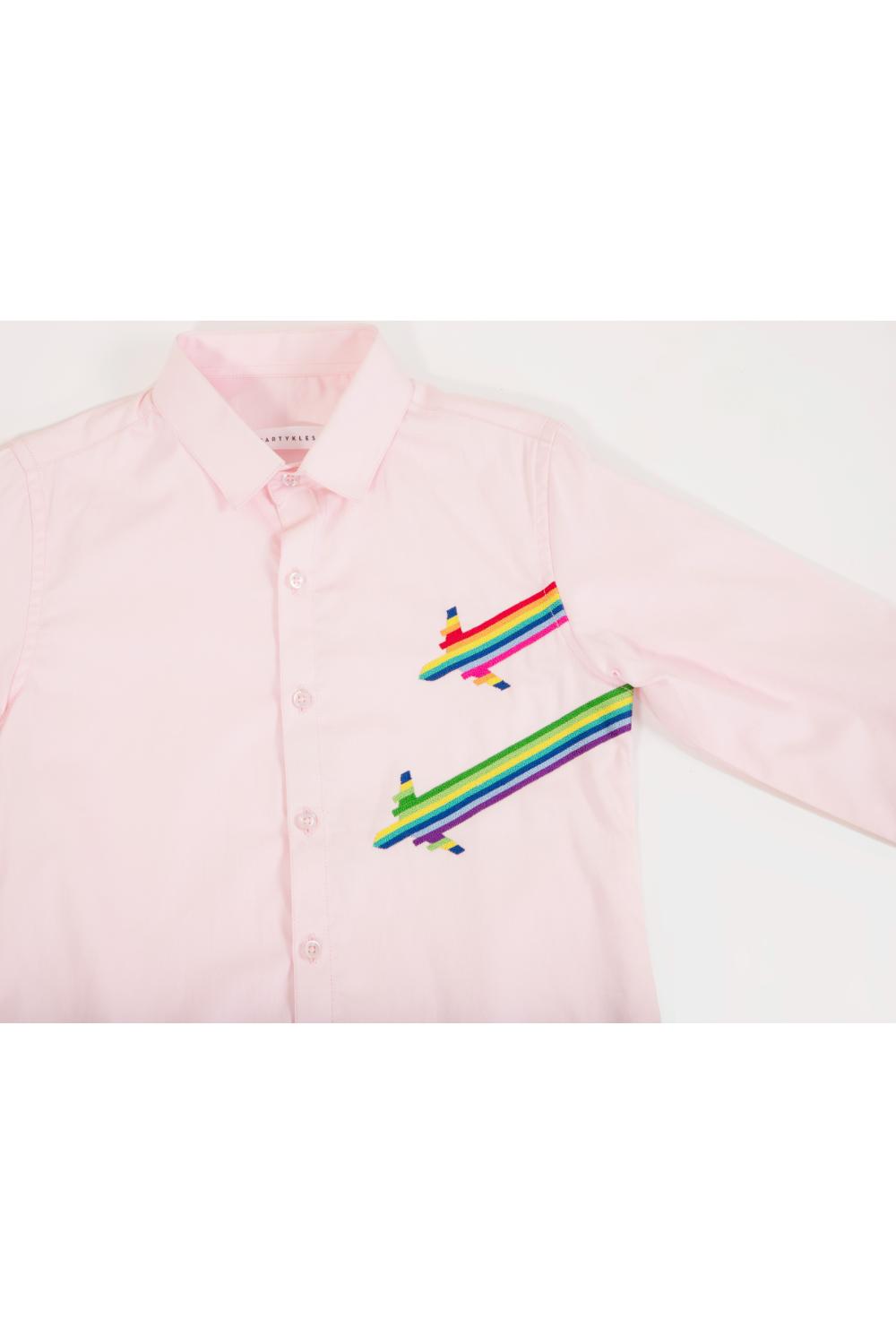 The rainbow aeroplane landing on a pink shirt