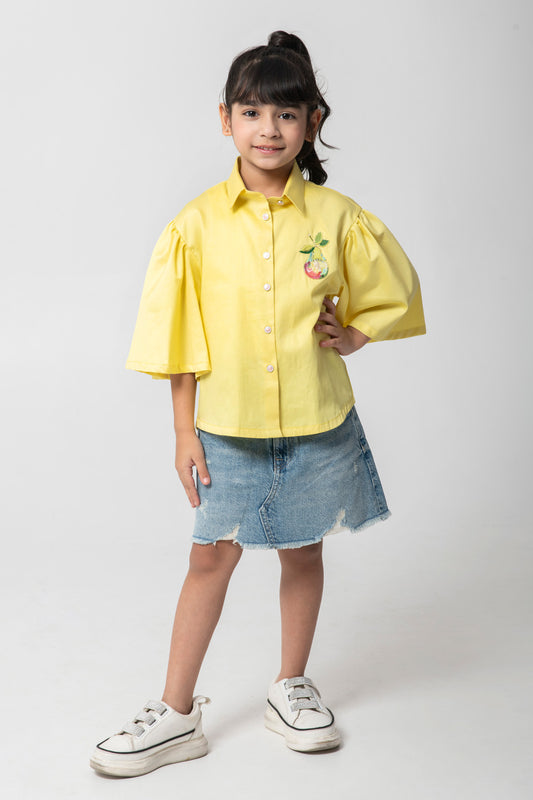 Yellow shirt with pear embroidered.