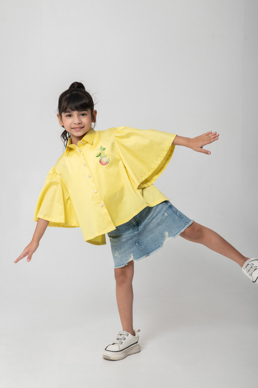Yellow shirt with pear embroidered.