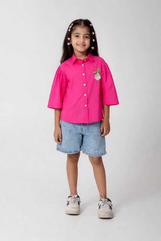 Pink shirt with pear embroidered.