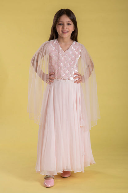 A FAIRYTALE BLUSH PINK LEHENGA SET FEATURING A BEAUTIFULLY EMBELLISHED PEARL SEQUIN BLOUSE WITH SHEER FULL FAIRY SLEEVES
