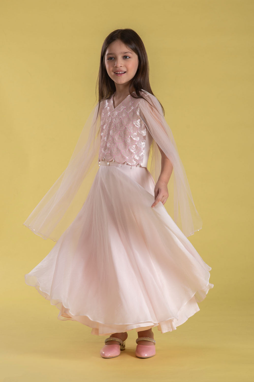 A FAIRYTALE BLUSH PINK LEHENGA SET FEATURING A BEAUTIFULLY EMBELLISHED PEARL SEQUIN BLOUSE WITH SHEER FULL FAIRY SLEEVES