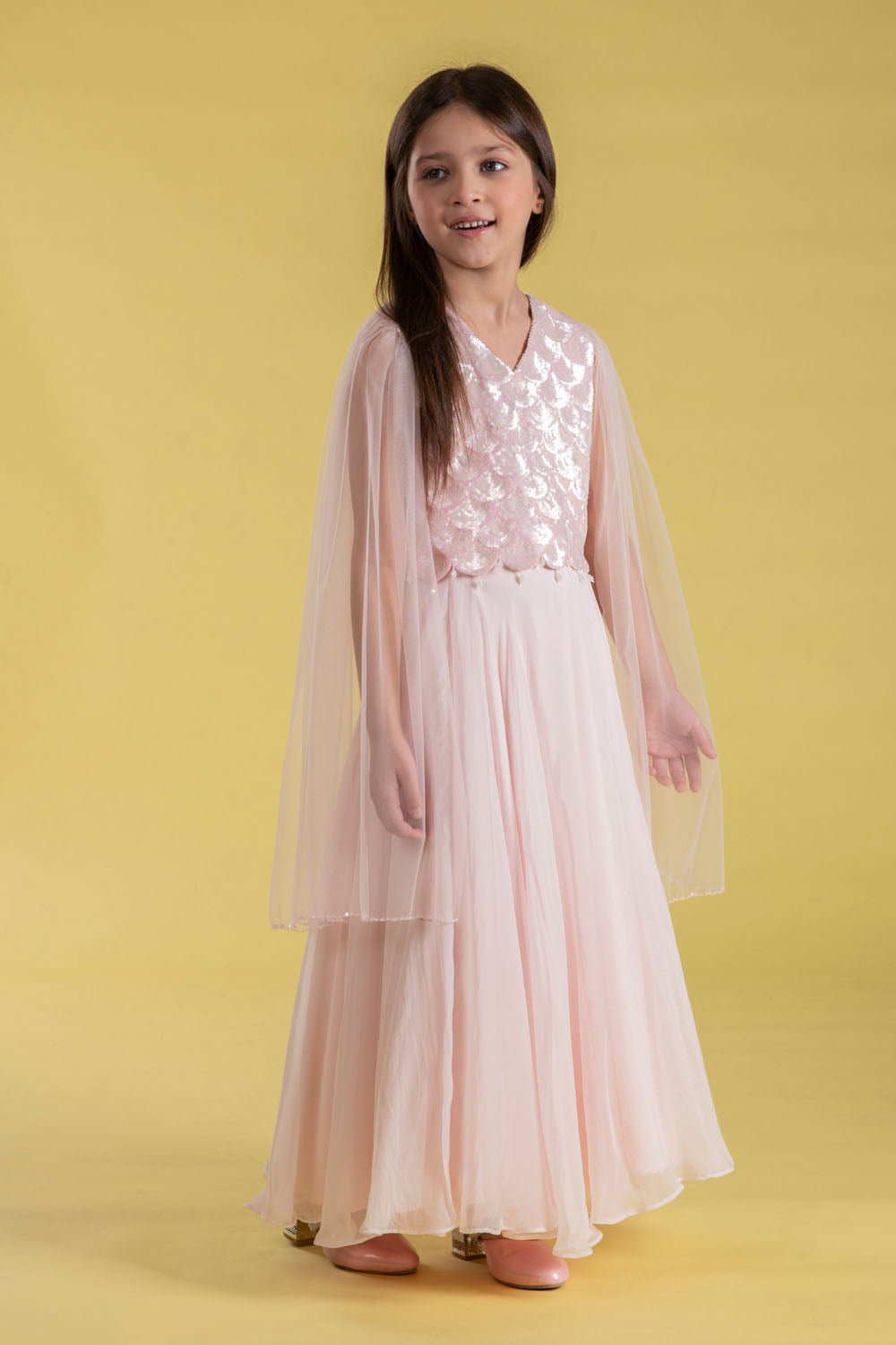 A FAIRYTALE BLUSH PINK LEHENGA SET FEATURING A BEAUTIFULLY EMBELLISHED PEARL SEQUIN BLOUSE WITH SHEER FULL FAIRY SLEEVES