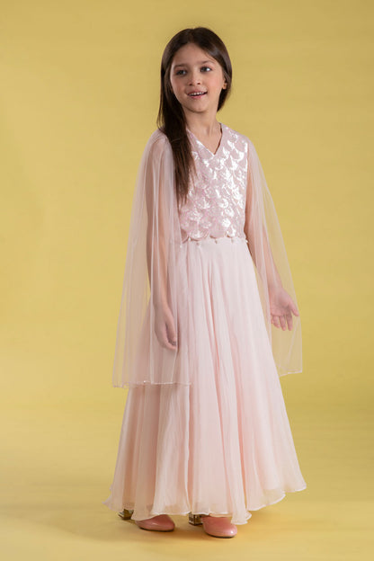 A FAIRYTALE BLUSH PINK LEHENGA SET FEATURING A BEAUTIFULLY EMBELLISHED PEARL SEQUIN BLOUSE WITH SHEER FULL FAIRY SLEEVES