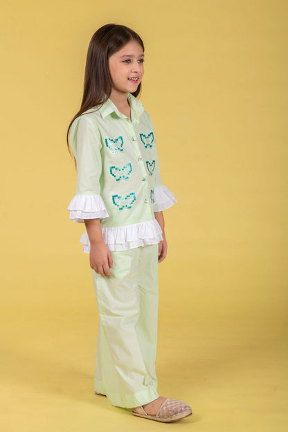 A MINT CO-ORD SET FEATURING A BUTTERFLY-EMBROIDERED SHIRT AND MATCHING WIDE-LEG PANTS.
