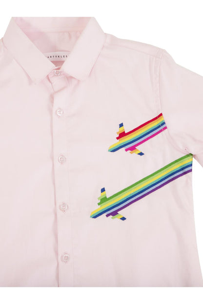 The rainbow aeroplane landing on a pink shirt