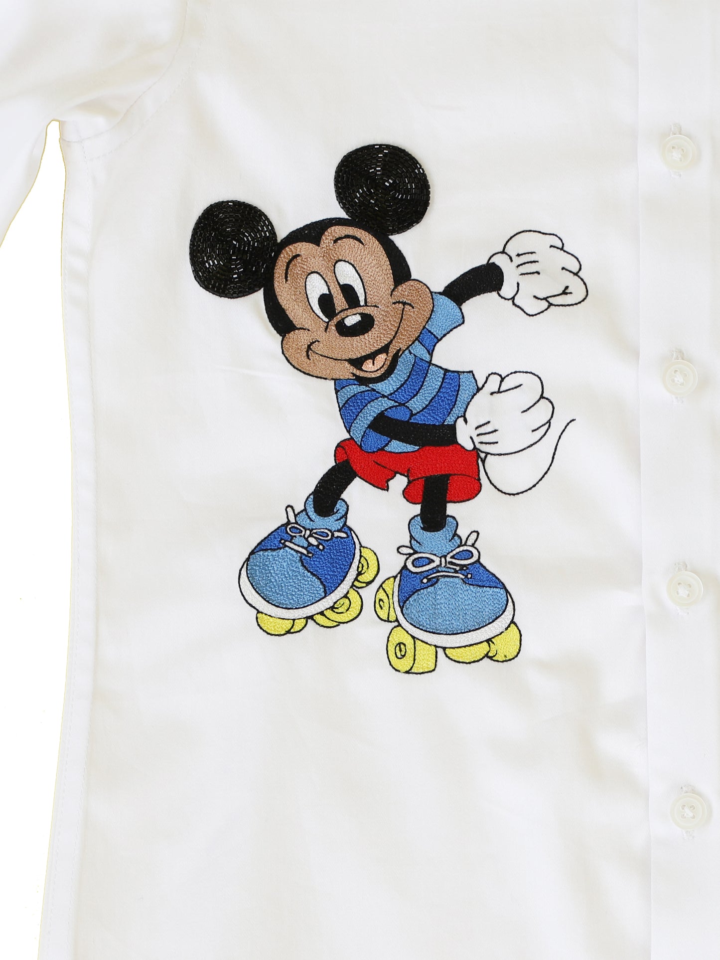 white shirt in cotton satin base with mickey mouse hand embroidery. 